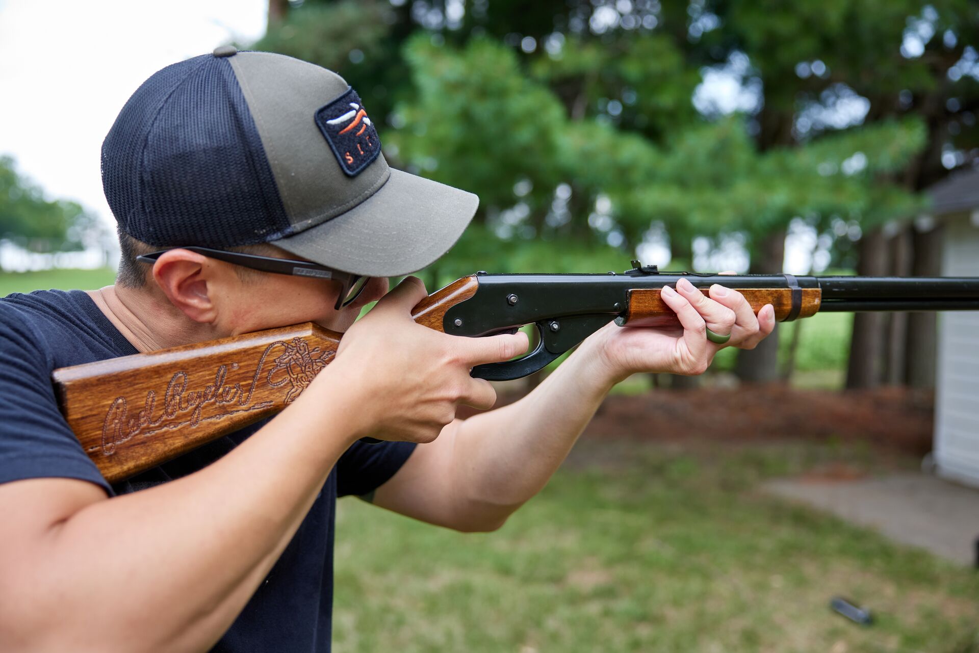 A hunter aims a bb gun. 