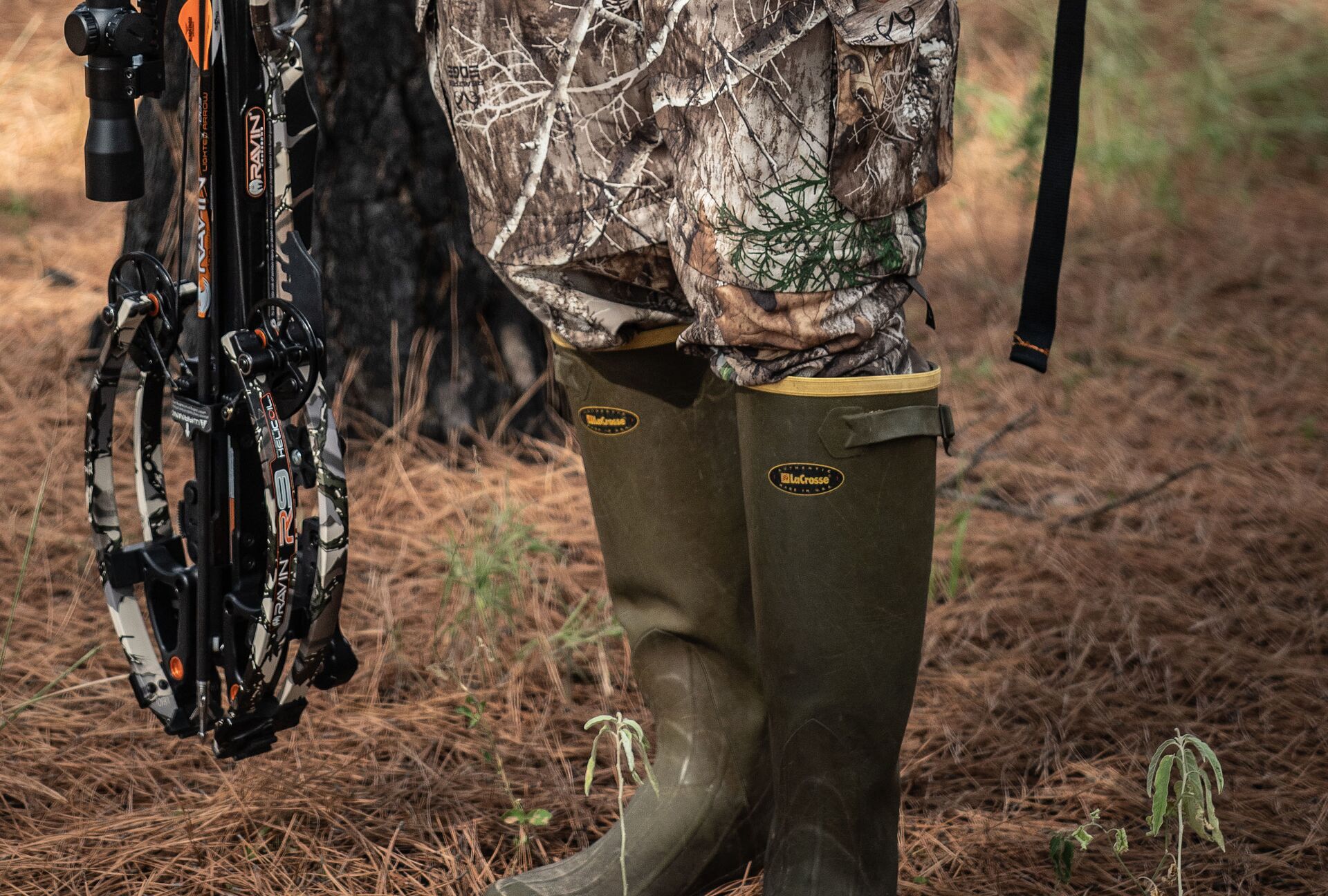 Close-up of a hunter in tall hunting boots. 