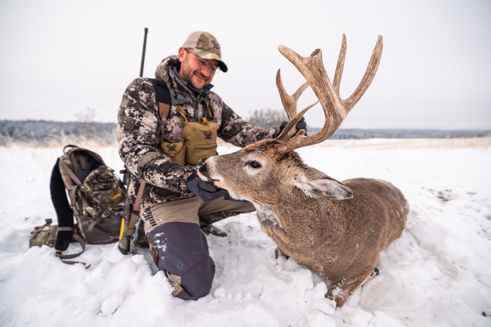 Hunter smiling with big buck after hunt, hunting for beginners concept. 