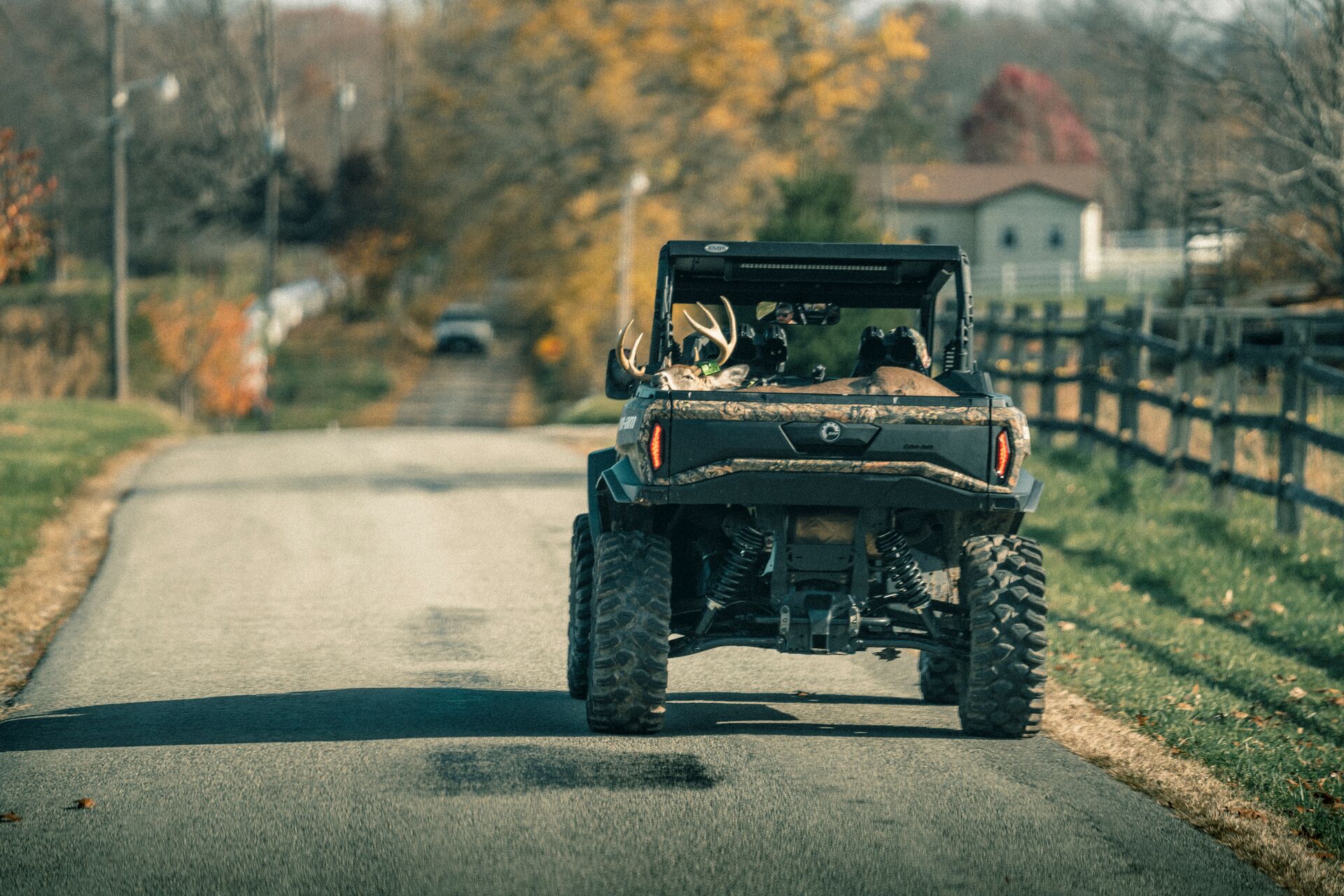 ATV carrying a deer in back after a hunt, deer season opening day concept. 