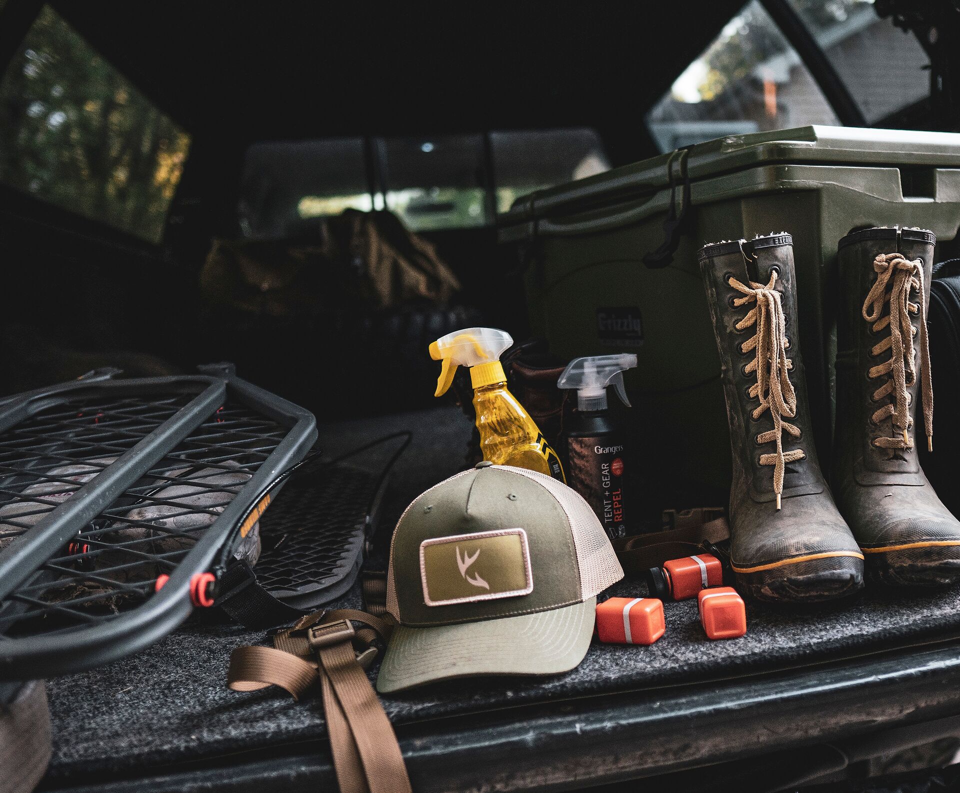 Hunting gear in the back of a truck, hunting equipment list concept. 