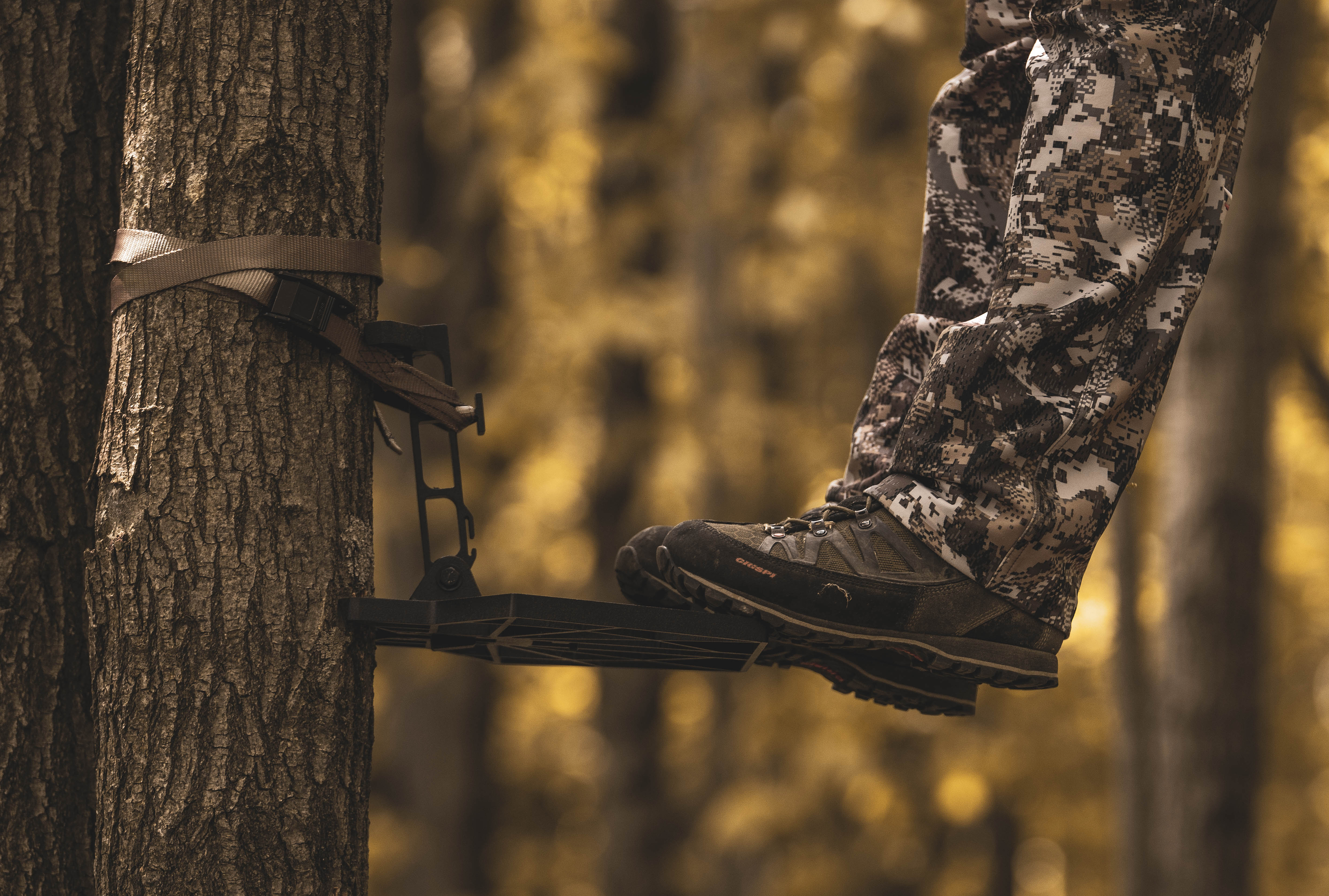 Close-up of a hunter's boots while in a tree stand, hunting gear concept. 