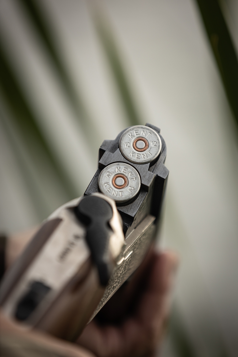 Close-up of shells in a shotgun, hunting for wild game recipes concept.