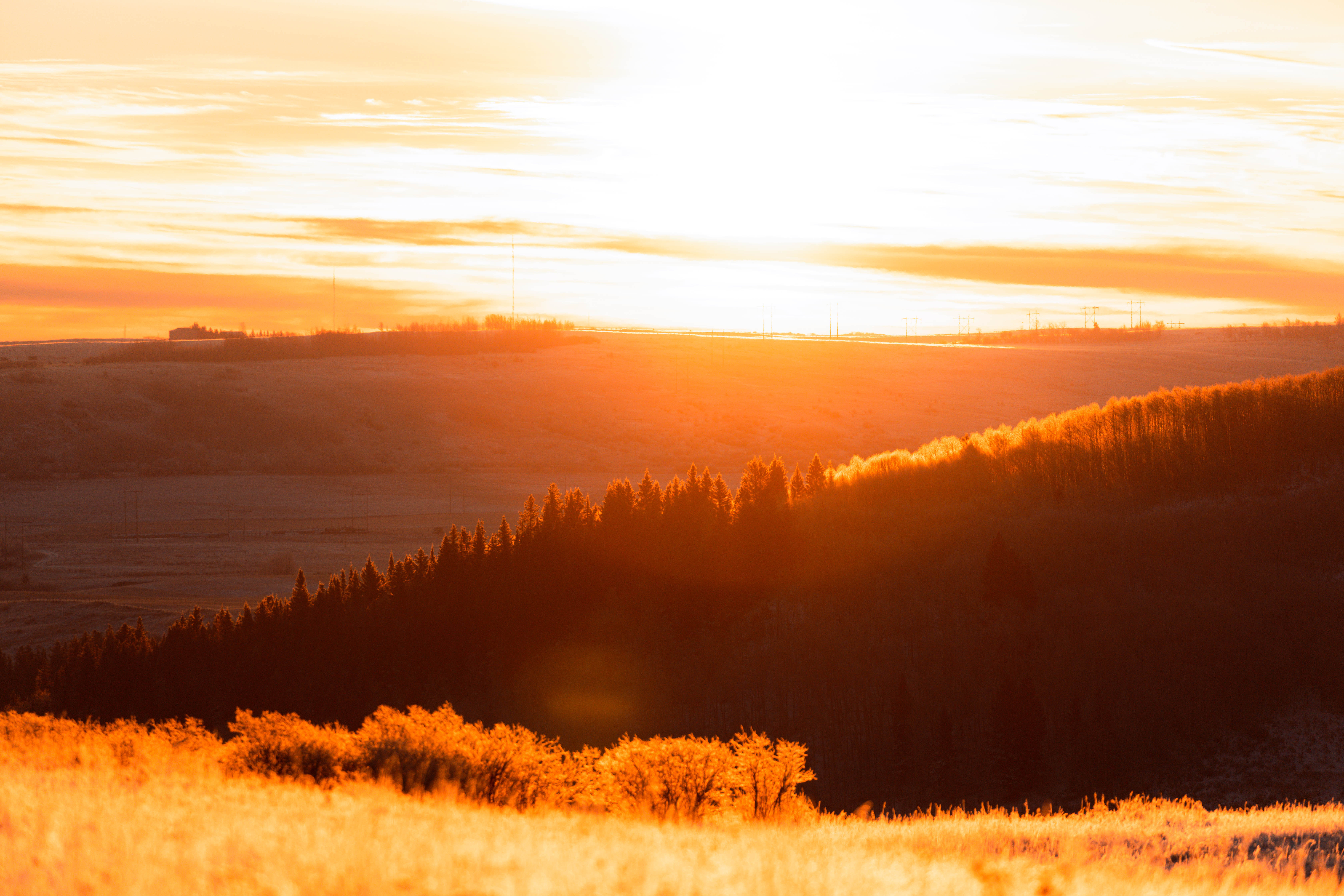 A broad view of a sunset over hills, hunting pheasant concept. 