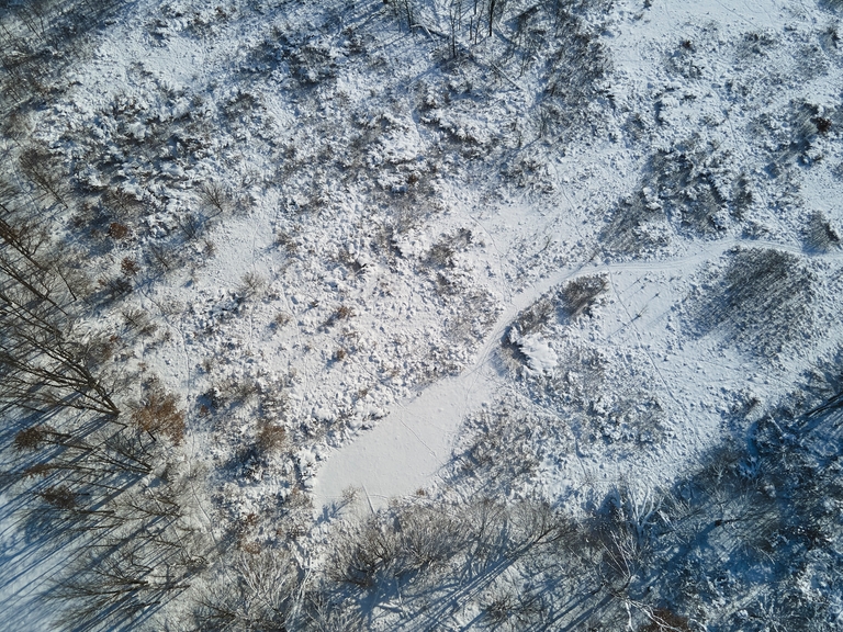 Aerial view of snow on the ground, Theresa Vail Alaska concept. 